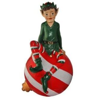 Outdoor elf sitting on an ornament