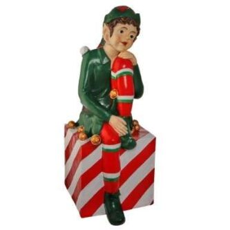 Outdoor Elf sitting on a Christmas Package