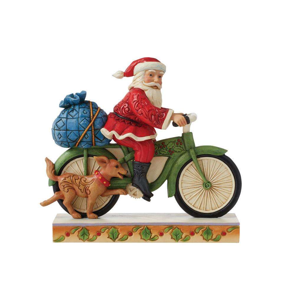 Side Santa Riding Bicycle by Jim Shore